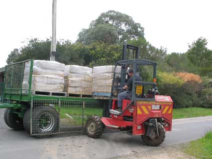 mudbricks being unloaded